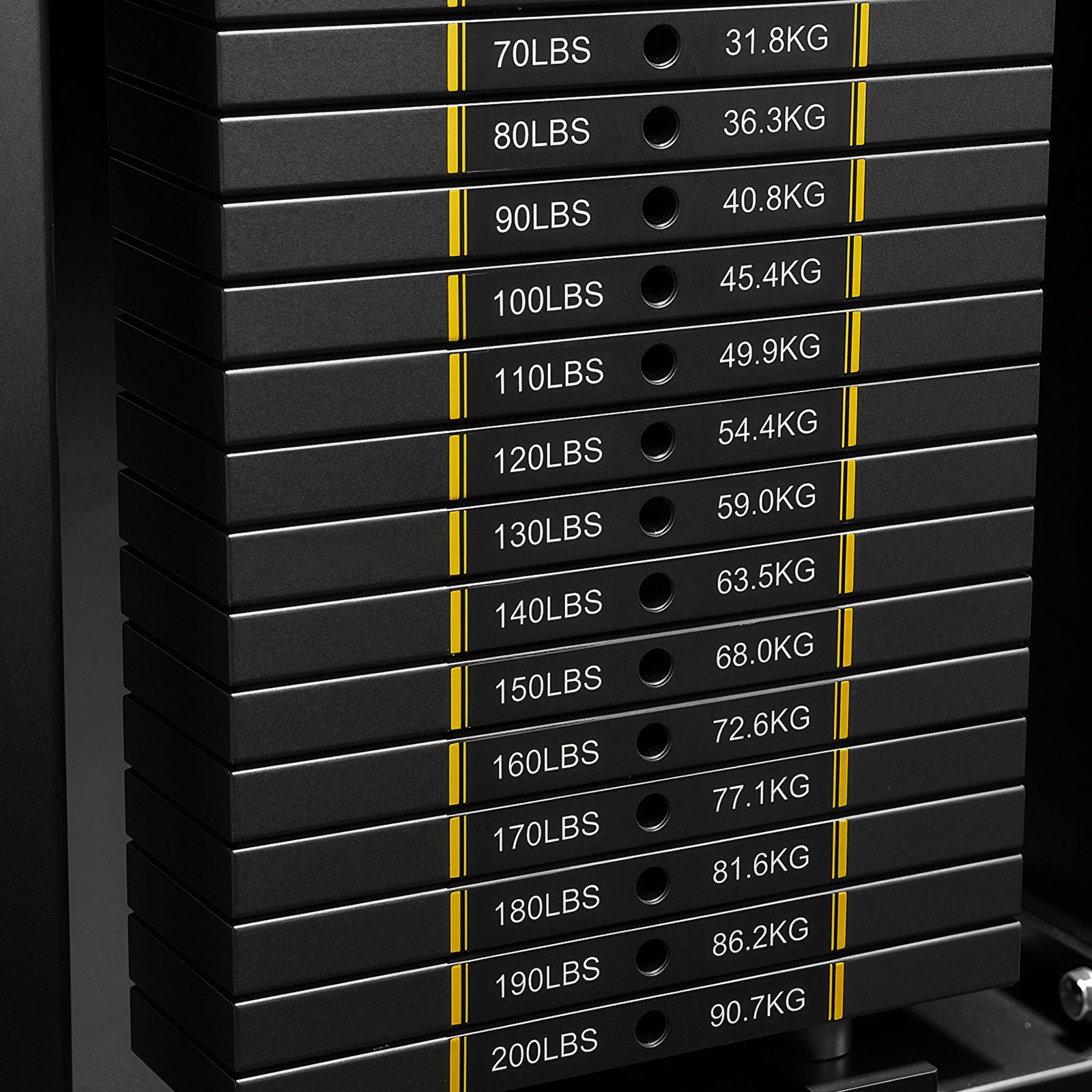 Close-up of the steel weight stack with dual LBS and KG markings on the Mikolo FALCON 2.0 Functional Trainer