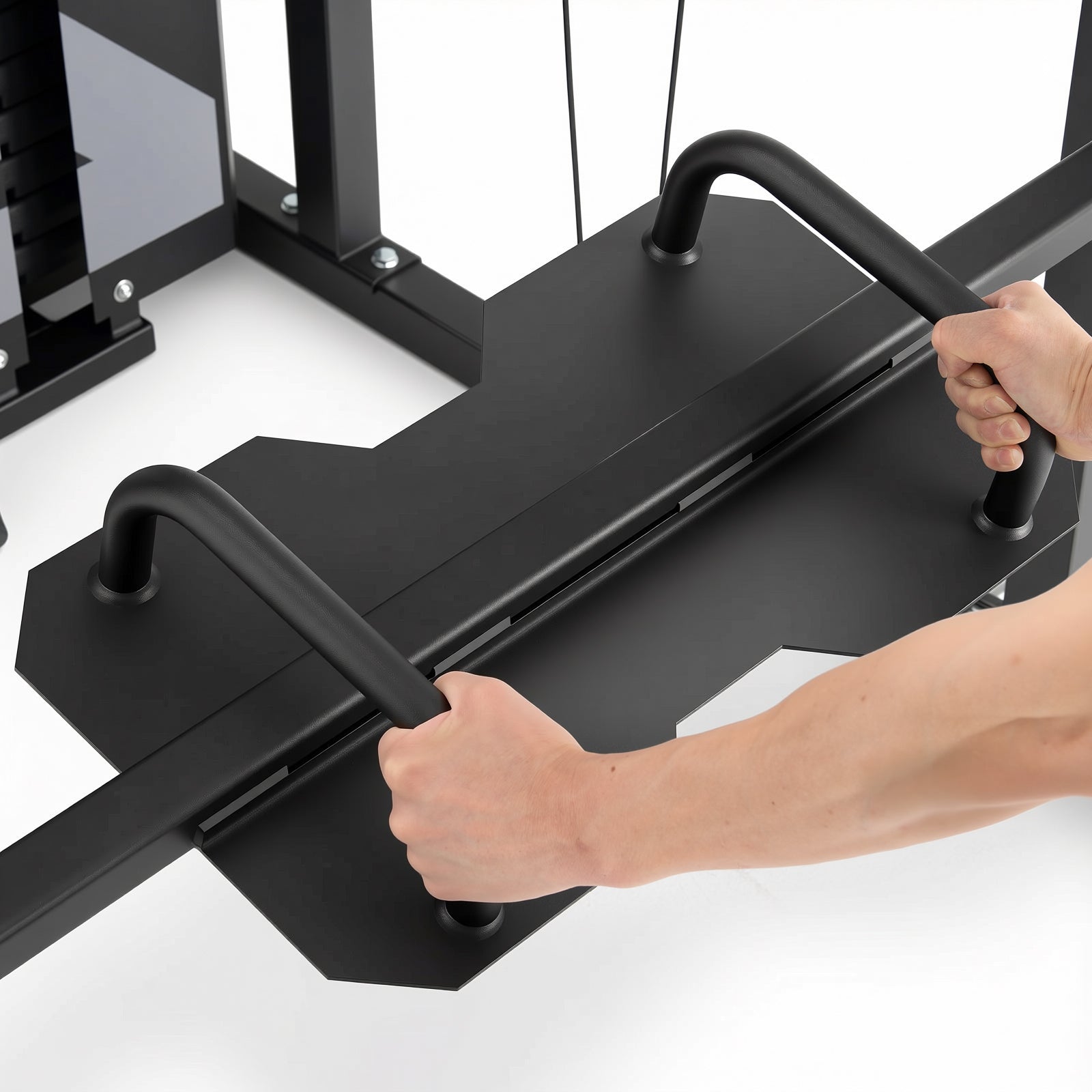 Close-up of a person's hands gripping the black curved handles of a rowing attachment on a black metal gym machine frame