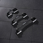 Three black Mikolo lat pulldown bars with silver rotating handles in varying sizes arranged on a speckled gym floor