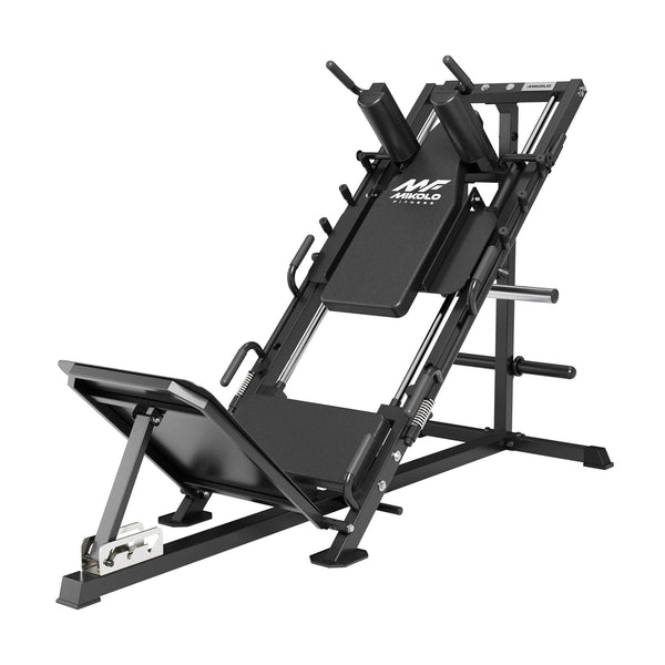 Black Mikolo leg press and hack squat machine with angled frame, shoulder pads, footplate, and weight storage pegs