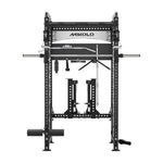 Black Mikolo power rack featuring a Smith machine bar, dual weight stacks, pull-up bar, and hanging cable attachments