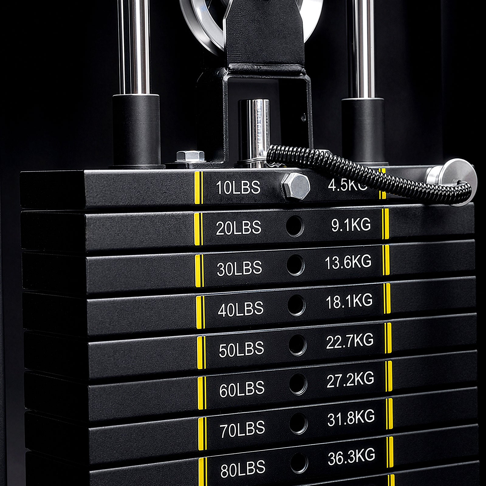 Close-up of the weight stack and magnetic selector pin with safety coil on the Mikolo FALCON 2.0 Functional Trainer