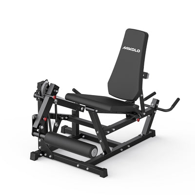 Black Mikolo leg extension and curl machine with padded seat, upright backrest, and cylindrical leg roller