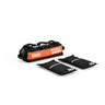 Black and orange Mikolo 10kg hybrid training sandbag with handles accompanied by two black 5kg weight inserts