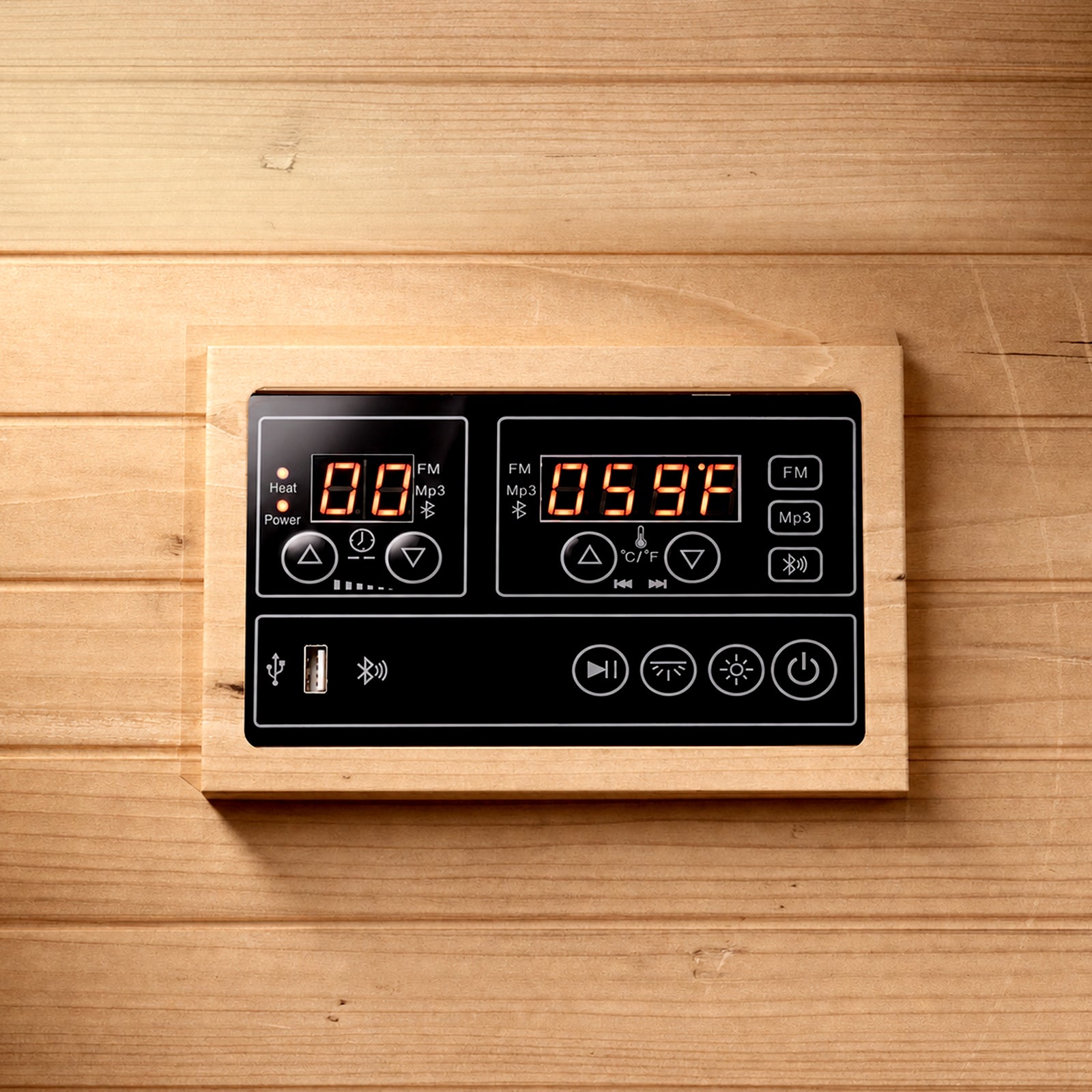 Digital sauna control panel showing red LED temperature and timer, with buttons for power, heat, lighting, USB, and media